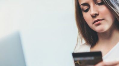 A woman looking at her electronic devices