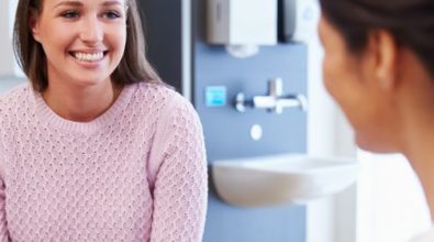 A woman speaking with a doctor