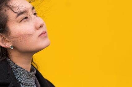 A woman staring away with sadly