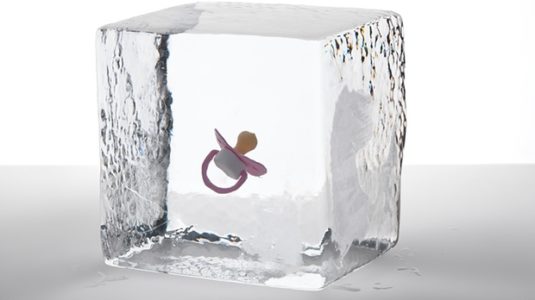 A pacifier in a block of ice