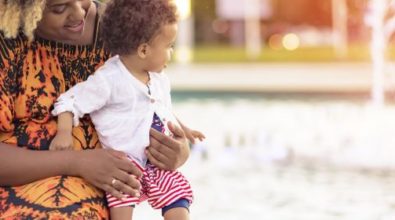 A woman playing with her son