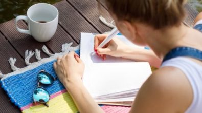 A woman writing on paper