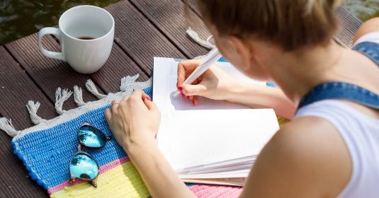 A woman writing on paper