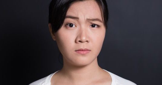 A woman with a confused look on her face