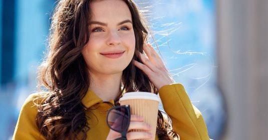 A woman drinking a coffee