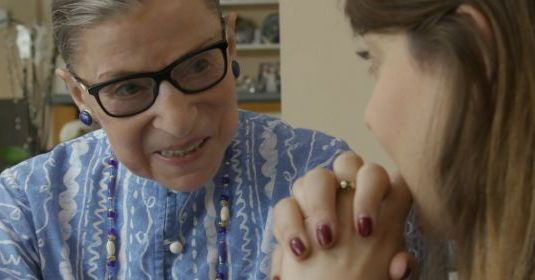 Ruth Bader Ginsburg speaking with a woman