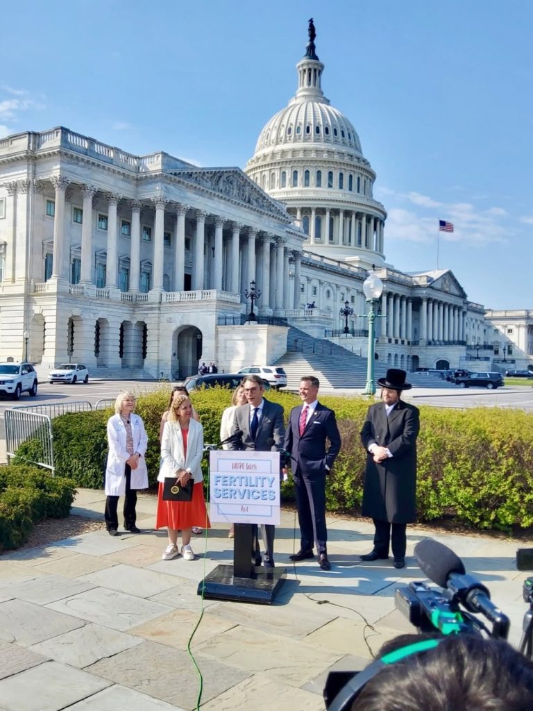 A group of healthcare professionals at the U.S. Capitol advocating for IVF and making fertility treatment more accessible